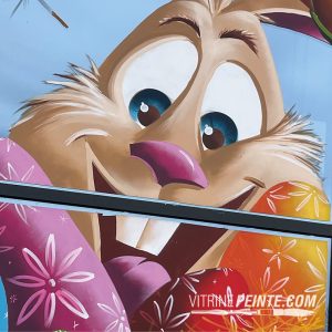 idée décoration : panier et lapin pâques géante, artiste peinture sur vitre Nice, déco magasin tendance 2026