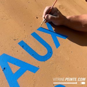 Peinture d'un logo XXL sur une cuve industrielle en béton